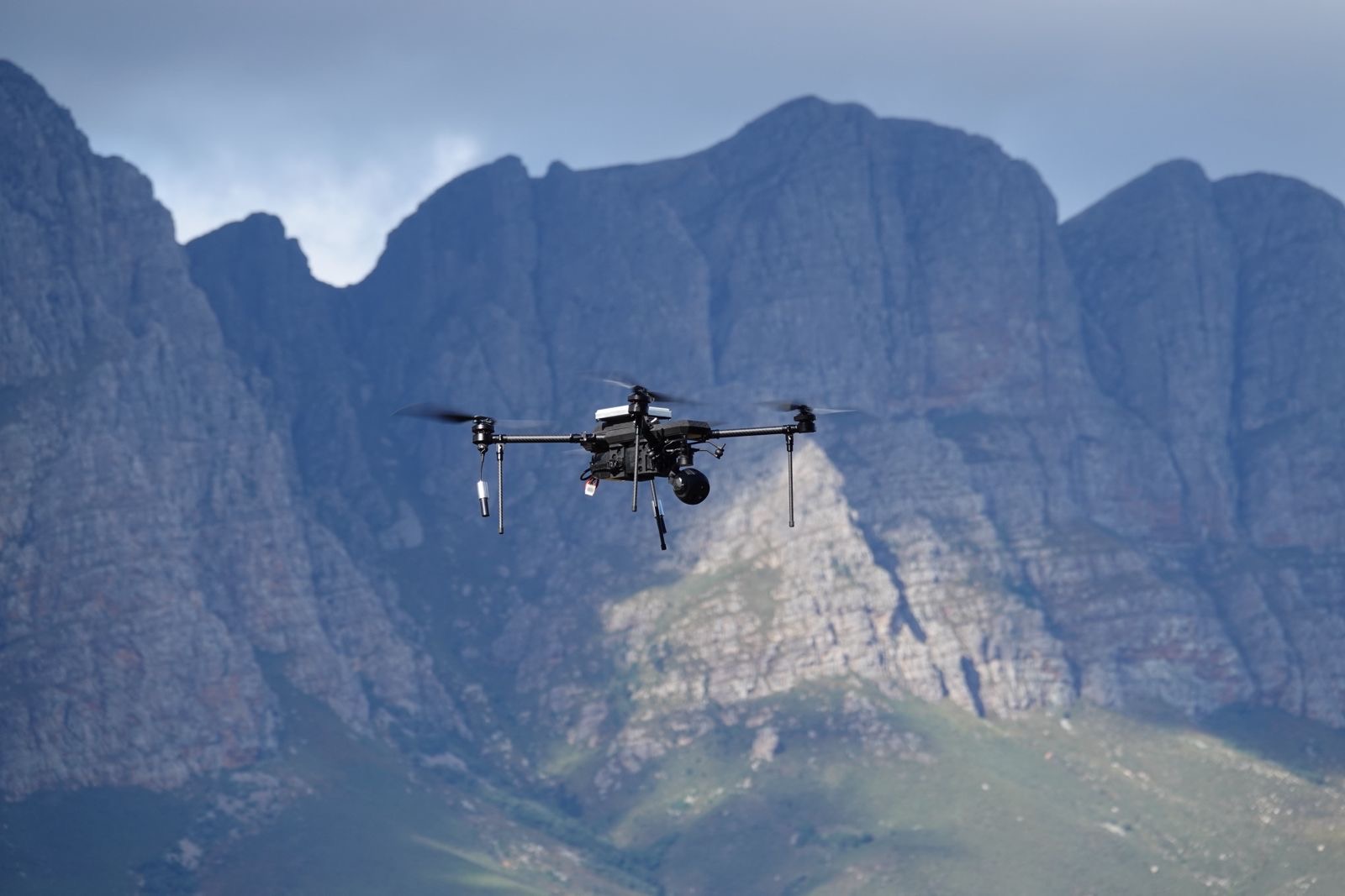 TCAT RECCE ISR drone in flight against a mountain range in South Africa TCAT RECCE ISR drone in flight against a mountain range in South Africa